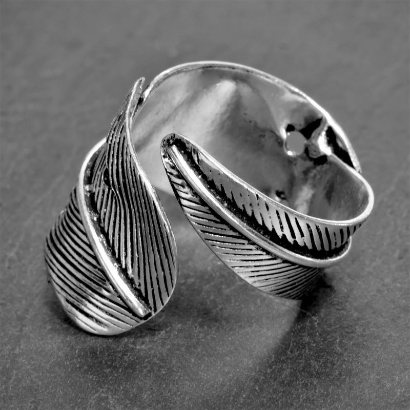 An adjustable, nickel free solid silver, chunky feather wrap ring designed by OMishka.