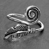 An adjustable, nickel free solid silver, dainty feather spiral wrap ring designed by OMishka.