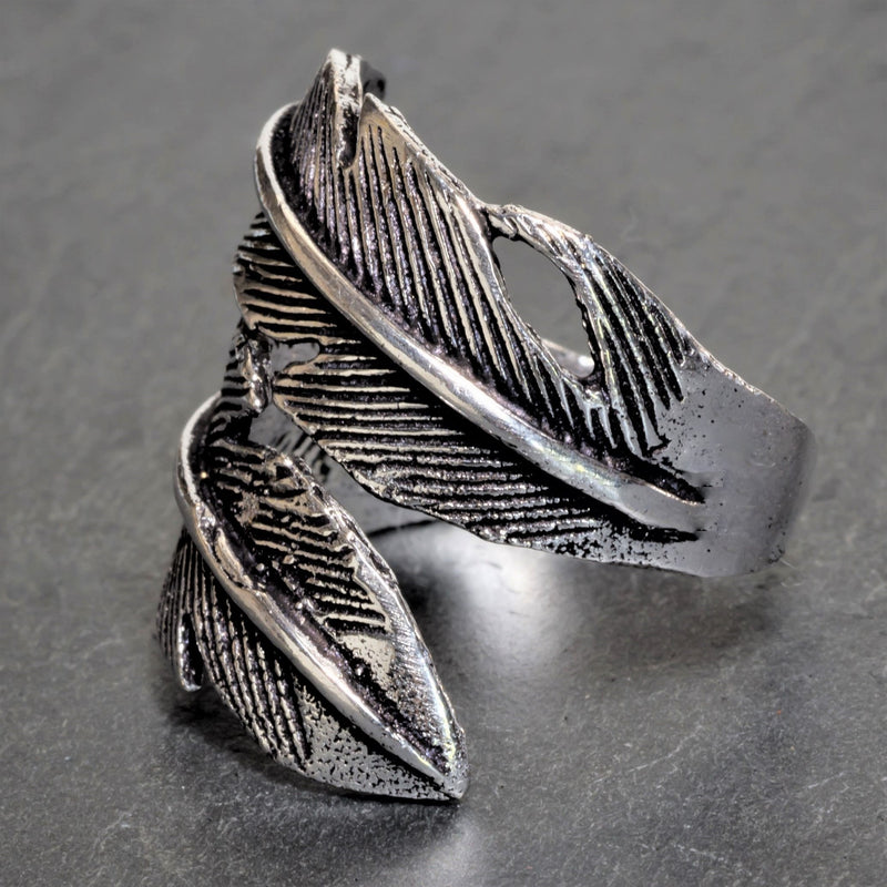 An adjustable, chunky, nickel free solid silver, double feather wrap ring designed by OMishka.