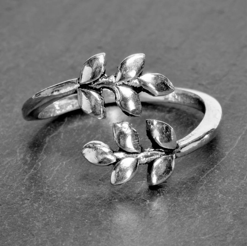 An adjustable, nickel free solid silver, dainty laurel leaf wrap ring designed by OMishka.