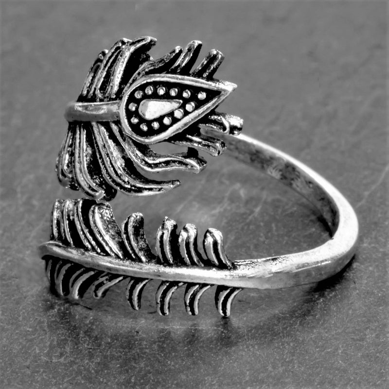 An adjustable, nickel free solid silver, dainty peacock feather wrap ring designed by OMishka.