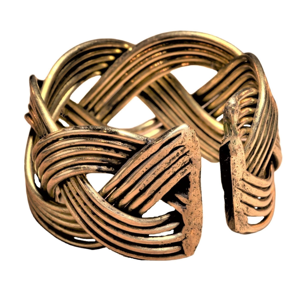 An adjustable, chunky, open weave plaited pure brass ring designed by OMishka.