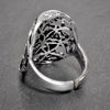An adjustable, large solid silver double seed of life ring designed by OMishka.