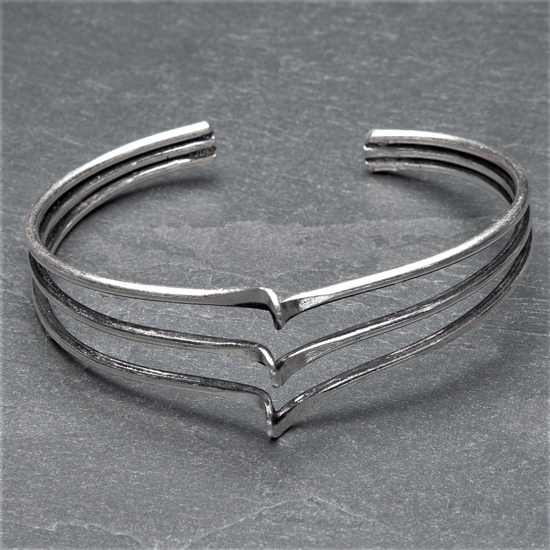 An adjustable silver triple wave bracelet cuff designed by OMishka.