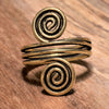 An adjustable triple wrap, pure brass open spiral toe ring designed by OMishka.
