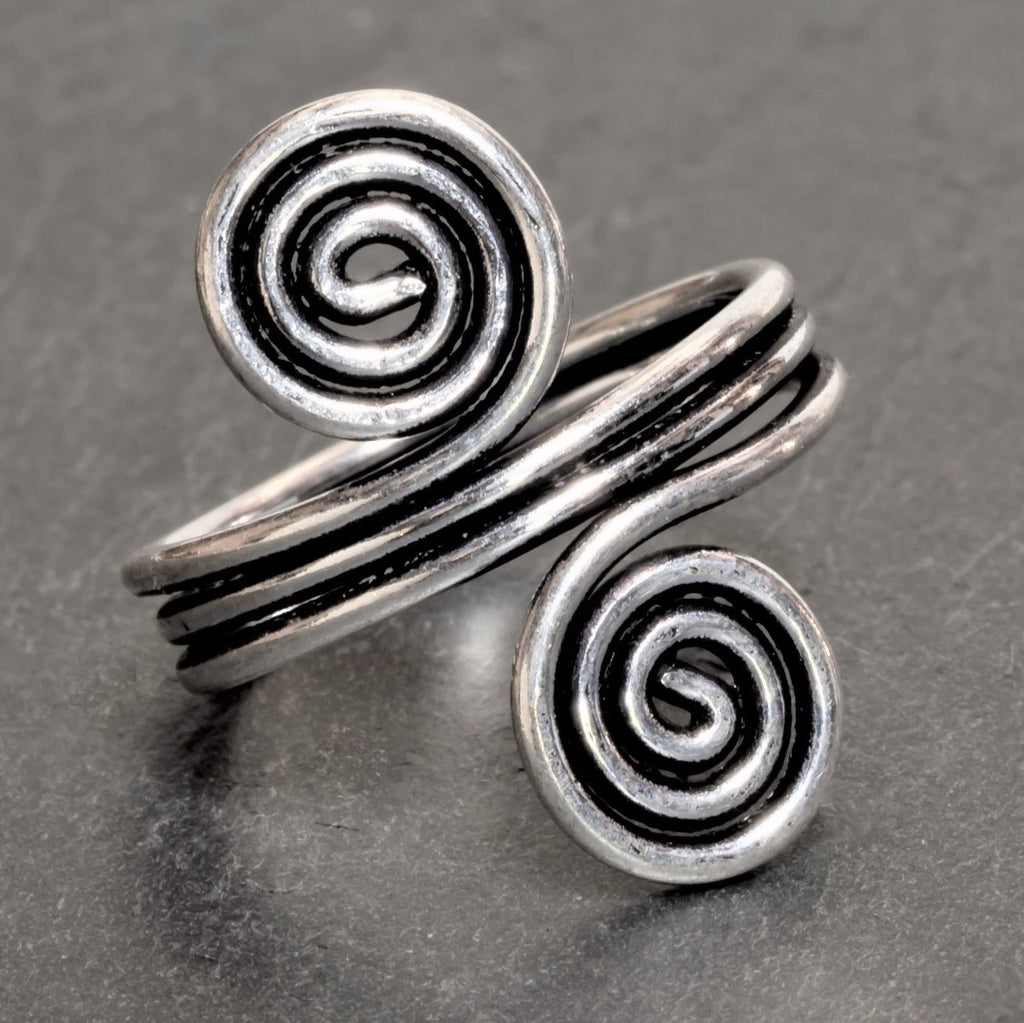 An adjustable triple wrap, solid silver open spiral toe ring designed by OMishka.