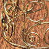 An adjustable wide, pure brass spiral patterned open bracelet designed by OMishka.