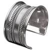 An adjustable, wide silver striped patterned concave cuff designed by OMishka.