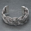 An adjustable woven, silver braid cuff bracelet designed by OMishka.