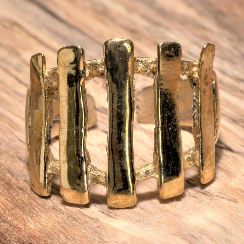 An adjustable, artisan handmade pure brass, open line striped ring designed by OMishka.