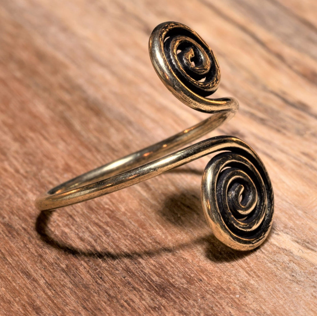 An artisan handmade, adjustable wrap, pure brass open spiral toe ring designed by OMishka.