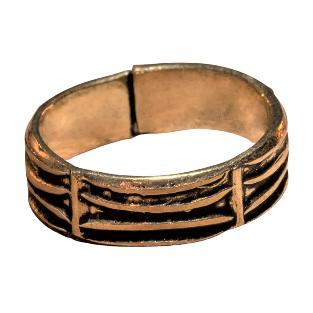 An artisan handmade, adjustable, pure brass etched tree bark patterned band toe ring designed by OMishka.