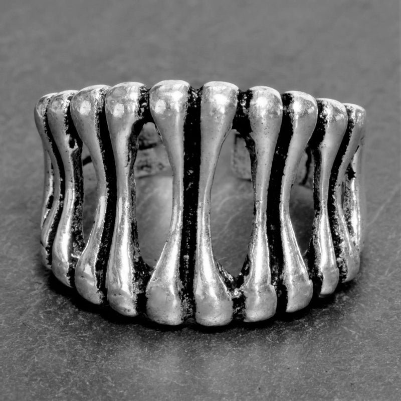 An adjustable, artisan handmade solid silver, skeletal bone shaped ring designed by OMishka.