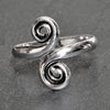A dainty, artisan handmade, adjustable solid silver open spiral wrap toe ring designed by OMishka.