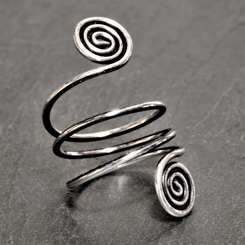 An artisan handmade, adjustable triple wrap, solid silver open spiral toe ring designed by OMishka.