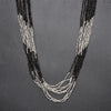 Artisan handmade, silver toned and black brass, beaded striped multi strand necklace designed by OMishka.