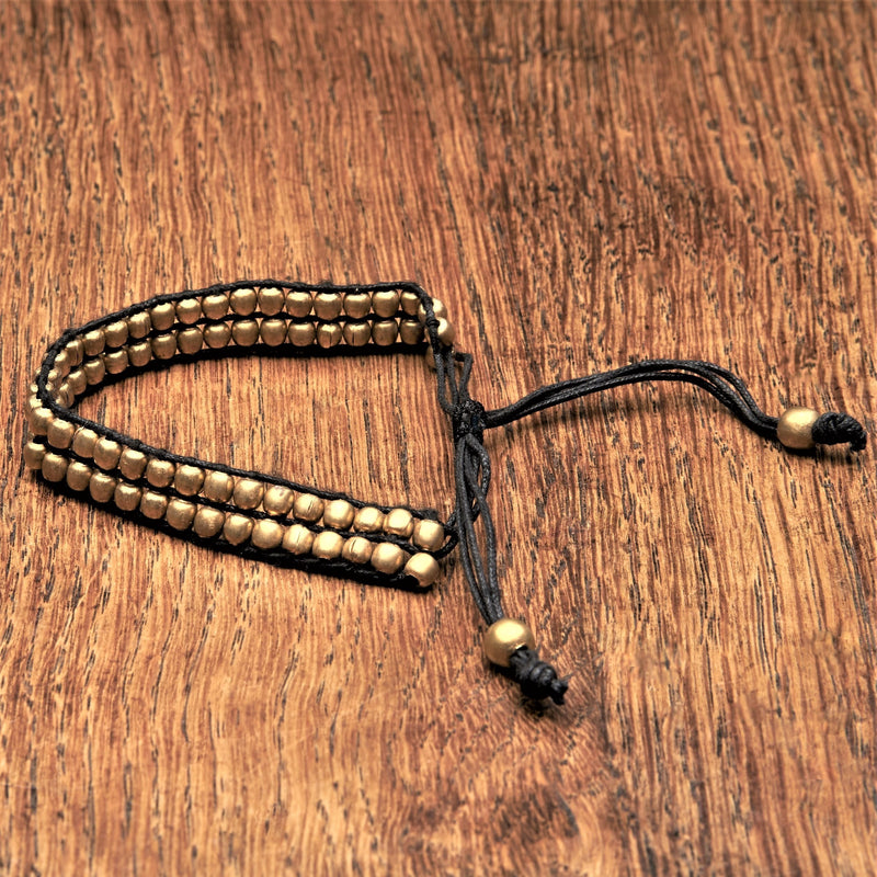 Artisan handmade tiny pure brass beaded, black woven hemp cord, adjustable bracelet designed by OMishka.