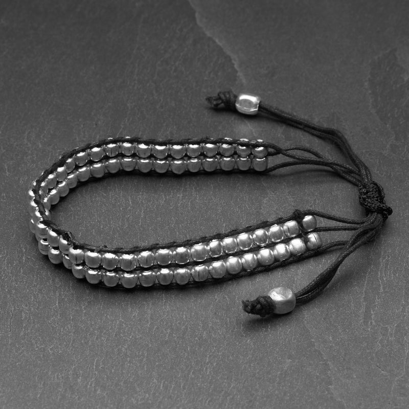 Artisan handmade tiny silver beaded, black woven hemp cord, adjustable bracelet designed by OMishka.