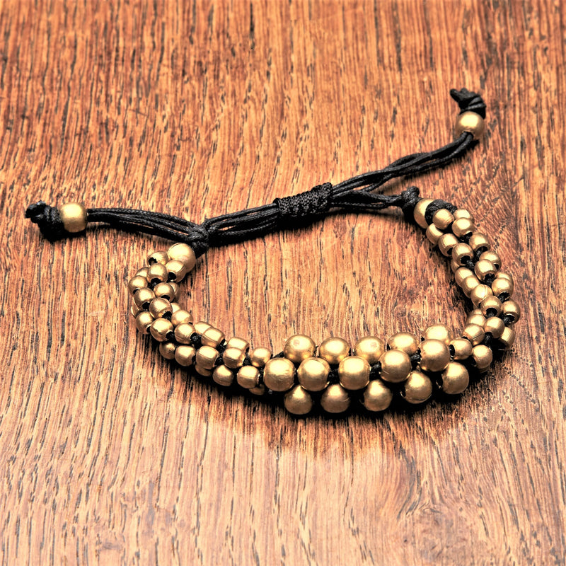 Artisan handmade pure brass, cluster beaded woven bracelet with an adjustable black waxed drawstring, designed by OMishka.