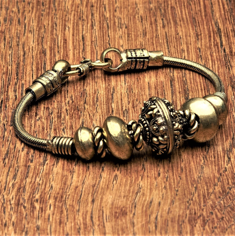 Artisan handmade pure brass, decorative floral beaded, snake chain bracelet designed by OMishka.
