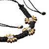 Artisan handmade brass beaded flower, black woven macrame, dainty adjustable bracelet designed by OMishka.