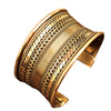 A wide, artisan handmade pure brass, stripe patterned concave cuff bracelet designed by OMishka.