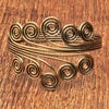 An artisan handmade pure brass, open spiral arm cuff bracelet designed by OMishka.