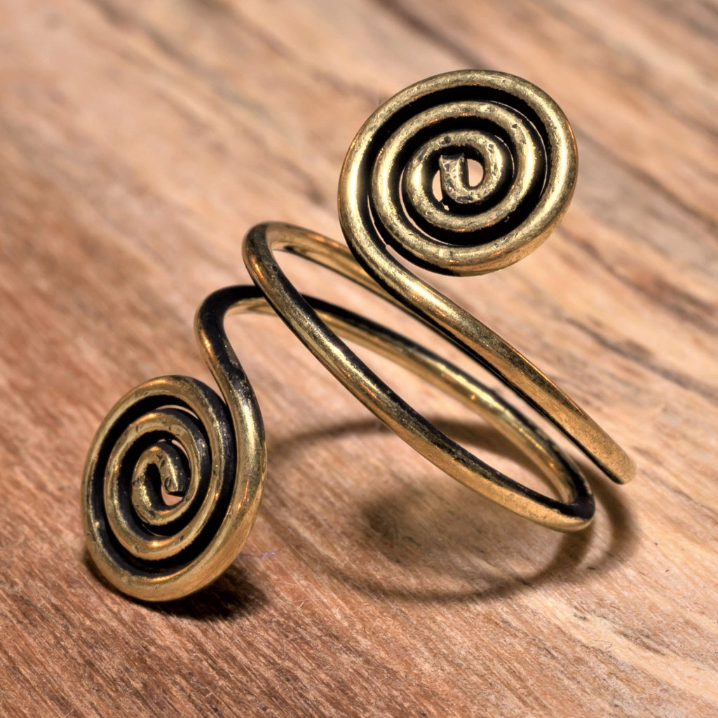 An artisan handmade, adjustable double wrap, pure brass open spiral toe ring designed by OMishka.