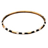 An artisan handmade, pure brass, black and white enamel striped thin bangle bracelet designed by OMishka.