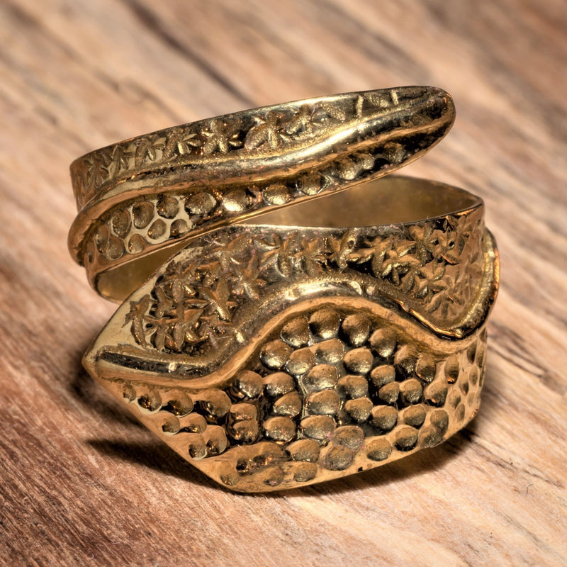 An adjustable, chunky, artisan handmade pure brass, dotted and swirl patterned wrap ring designed by OMishka.
