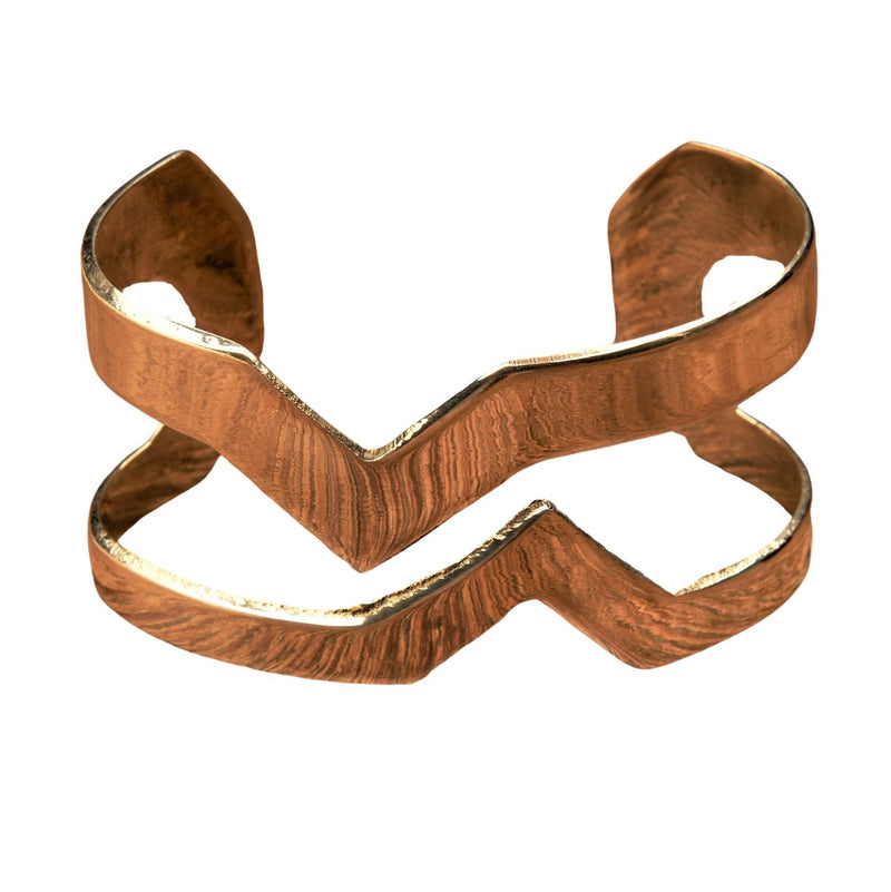 An artisan handmade, chunky pure brass cut out zig zag cuff bracelet designed by OMishka.