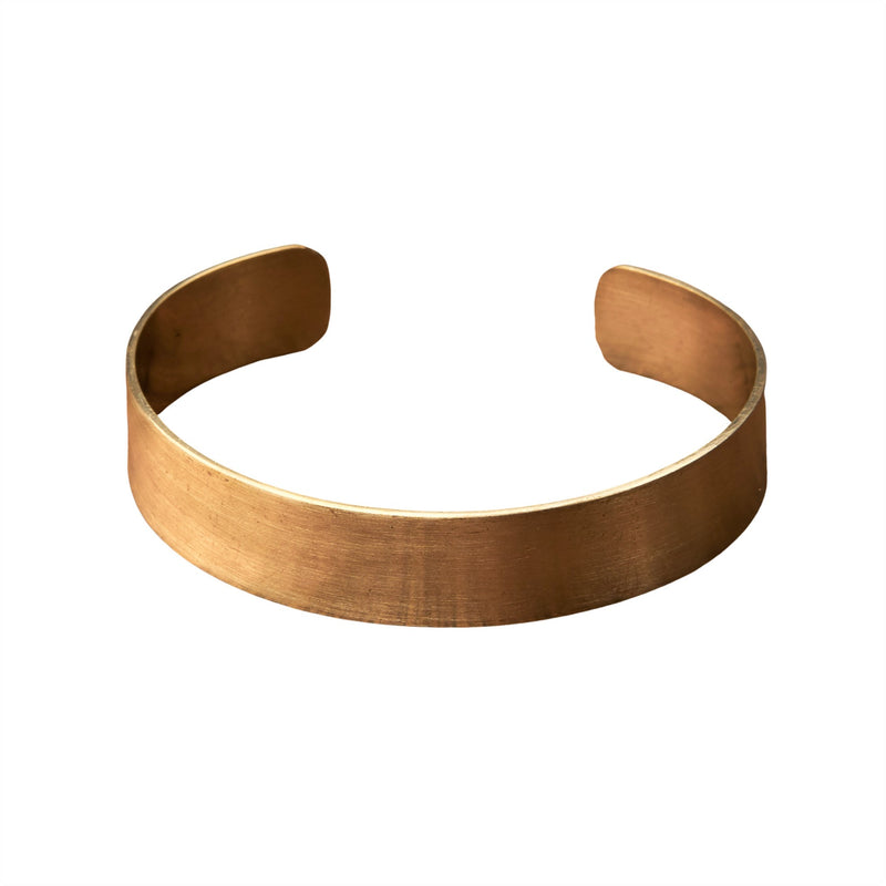 An artisan handmade, brushed pure brass simple torque bracelet designed by OMishka.