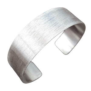 An artisan handmade, brushed silver simple torque bracelet designed by OMishka.