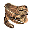 An adjustable, chunky, artisan handmade pure brass feather wrap ring designed by OMishka.
