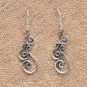 Artisan handmade, dainty solid silver swirl drop hook earrings designed by OMishka.