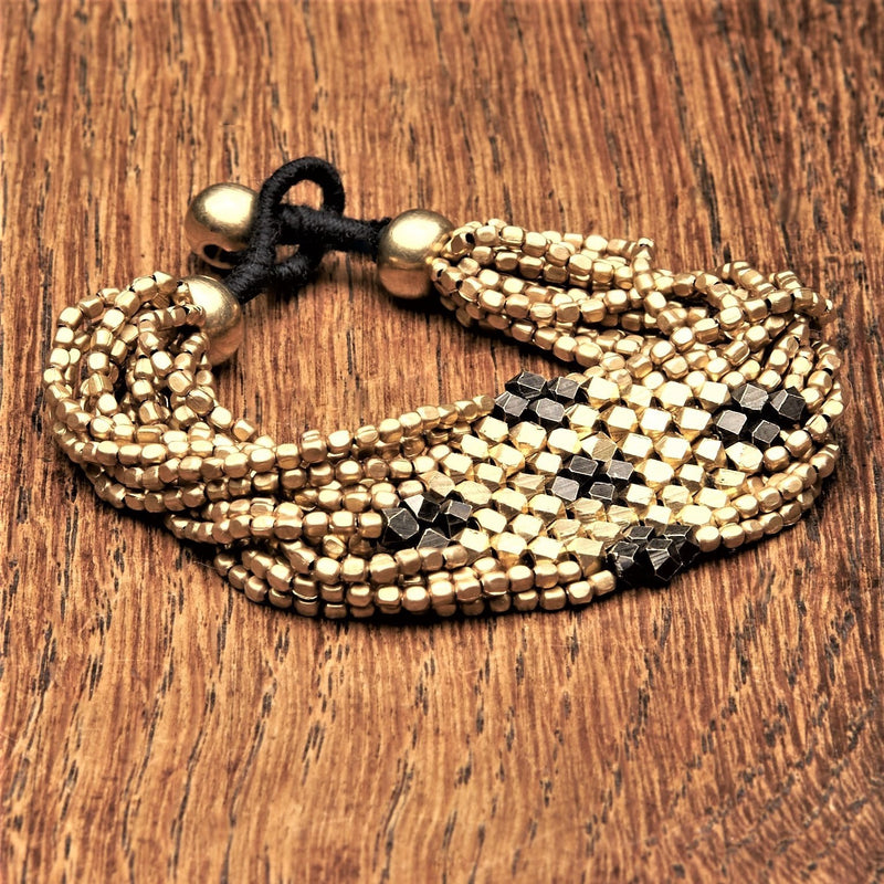 Artisan handmade two tone, brass and black beaded diamond shaped, multi strand bracelet designed by OMishka.