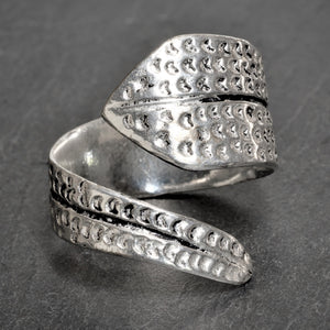 An adjustable, artisan handmade solid silver, chunky dotted swirl wrap ring designed by OMishka.