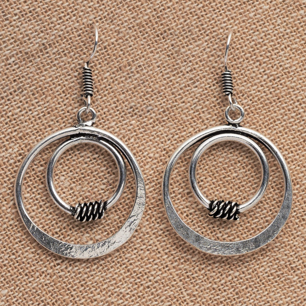 Artisan handmade solid silver, double nested circle, drop hook earrings designed by OMishka.