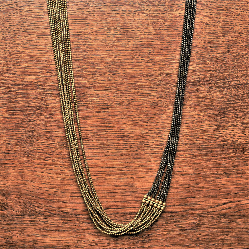 Artisan handmade, striped golden and black brass, long beaded multi strand necklace designed by OMishka.