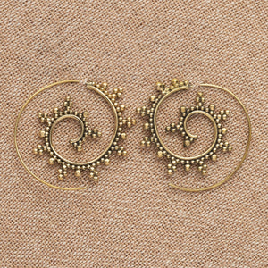 Artisan handmade pure brass, large, decorative dotted spiral hoop earrings designed by OMishka.