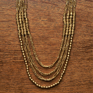 Artisan handmade, layered, pure brass beaded multi strand necklace designed by OMishka.