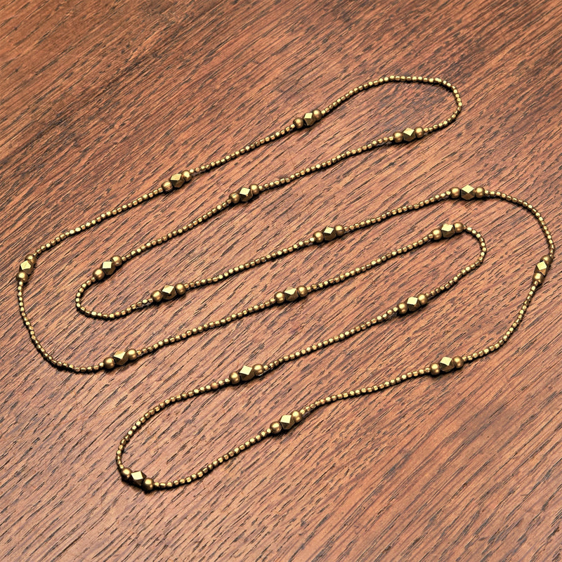 Artisan handmade pure brass, simple single strand, long beaded necklace designed by OMishka.