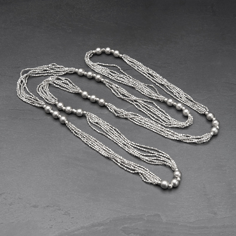 Artisan handmade, chunky, silver toned brass, long beaded multi strand necklace designed by OMishka.