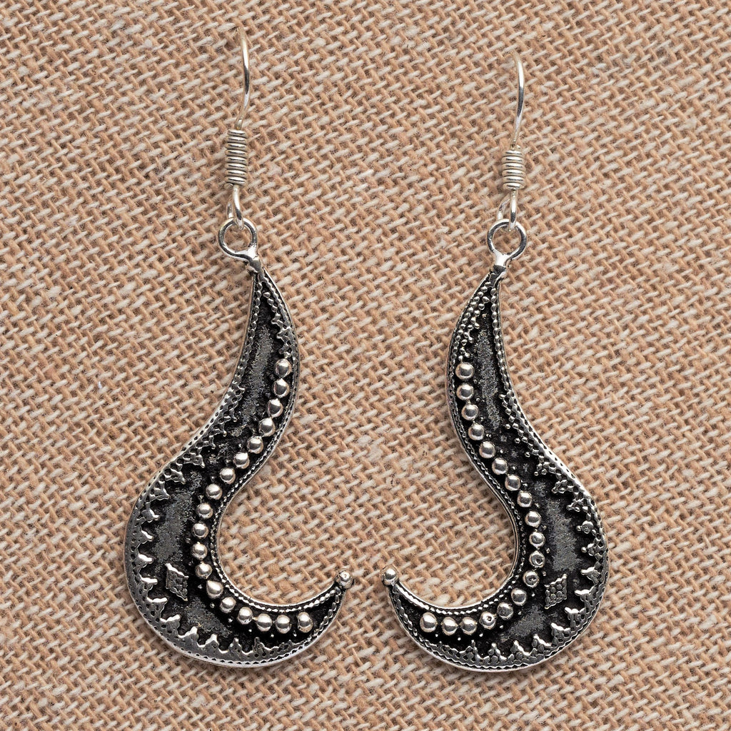 Artisan handmade solid silver, tribal patterned, long swirl shaped dangle earrings designed by OMishka.