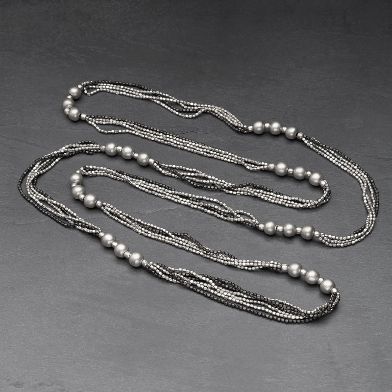 Artisan handmade, striped silver toned and black brass, beaded, long multi strand necklace designed by OMishka.