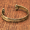 An elegant, artisan handmade multi strand hammered pure brass cuff bracelet designed by OMishka.