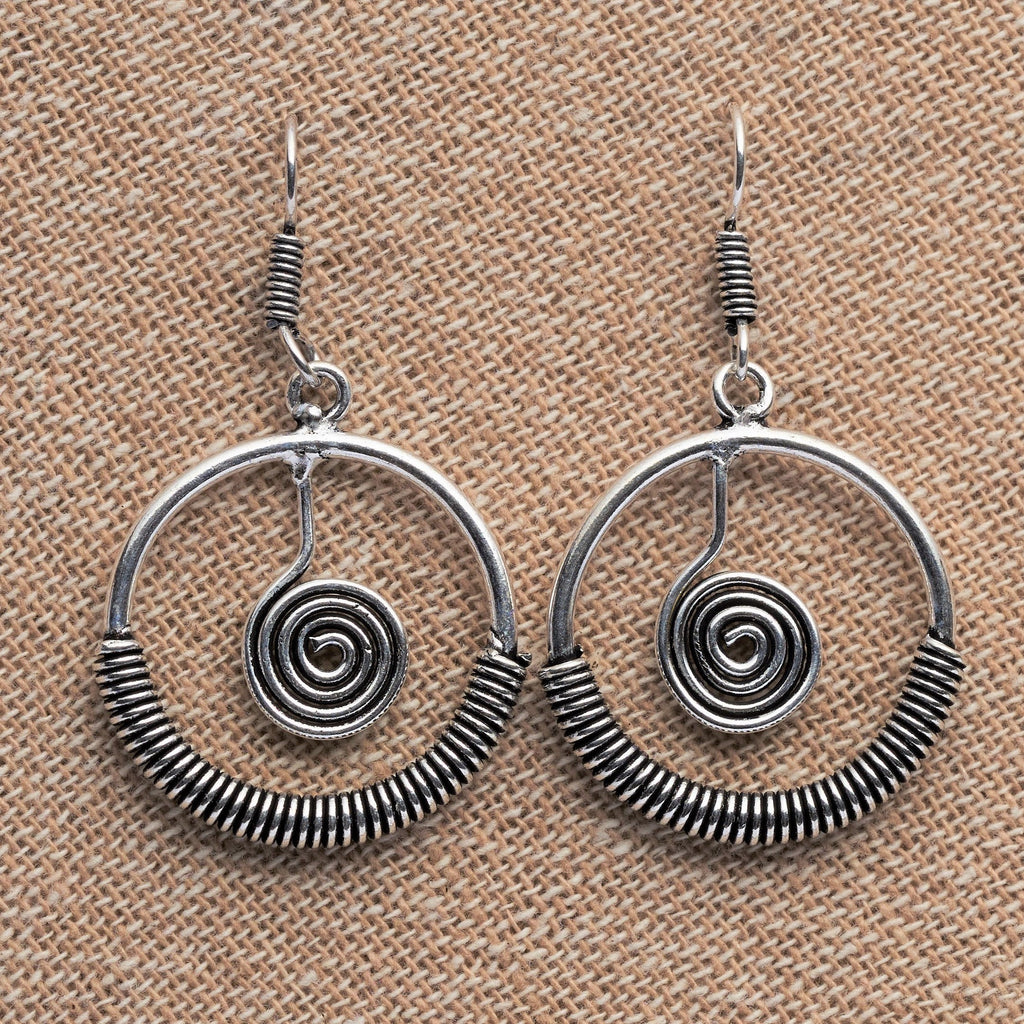 Artisan handmade solid silver, coiled open circle, spiral centred, drop hook earrings designed by OMishka.