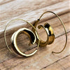 Artisan handmade pure brass, concave shaped spiral wave hoop earrings designed by OMishka.