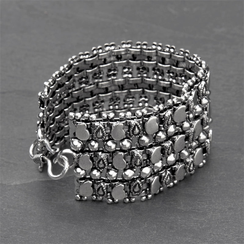 Artisan handmade silver toned brass, beaded and mango motif patterned, tribal chain bracelet designed by OMishka.