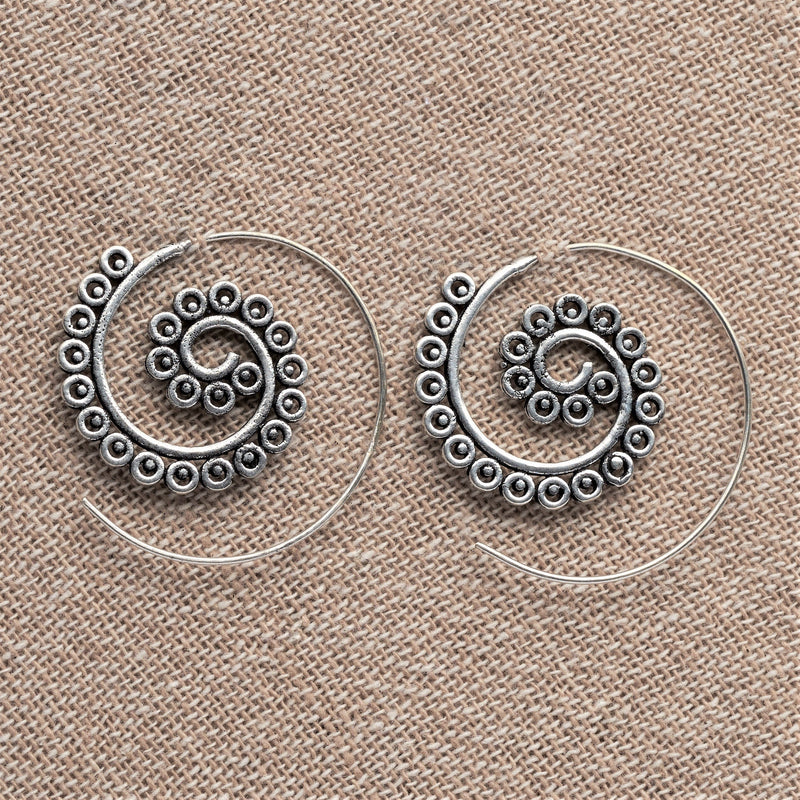 Artisan handmade solid silver, tiny circle and dot patterned, dainty spiral hoop earrings designed by OMishka.